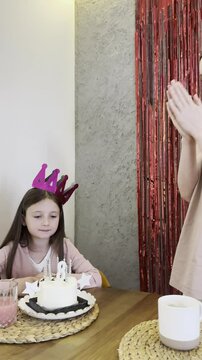 Celebrating a child's birthday with cake and candles