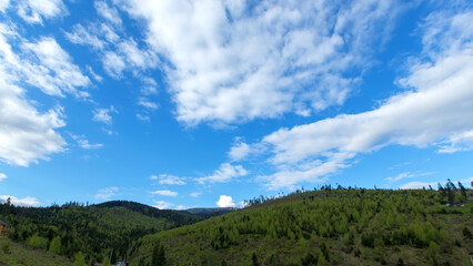 Fototapeta premium Landscape of mountains and a cloudy blue sky. Ukraine, Carpathians.