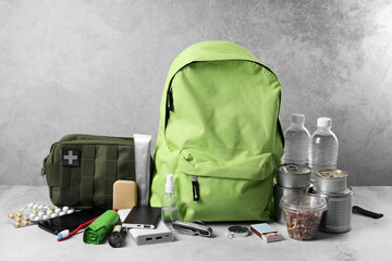 Survival kit. Different emergency supplies on light table
