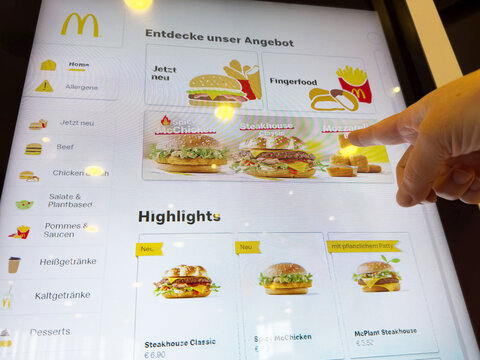 Interactive fast food ordering screen in german mcdonald's restaurant