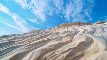 Wonderful sandy mountains in windy weather under open blue cloudy sky