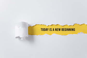 torn paper background with today is a new beginning message
