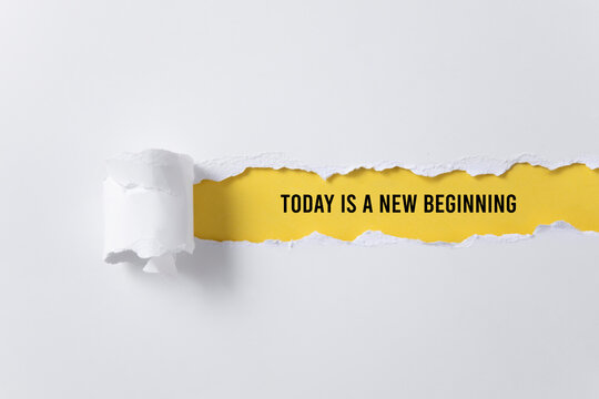 torn paper background with today is a new beginning message