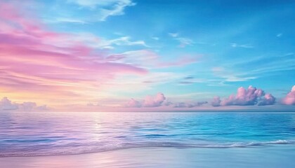 Obraz premium Serene ocean sunset with vibrant pink and blue hues reflecting on calm waters.
