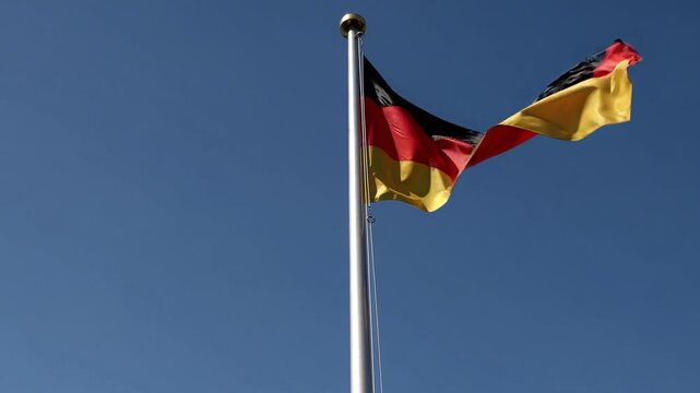German flag waving in wind, symbol of unity and national identity