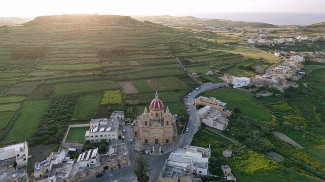 Experience the breathtaking aerial views of Malta's stunning landscapes and historic architecture at sunset