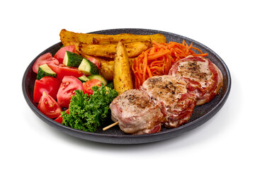 Bacon-wrapped pork medallions, isolated on white background.