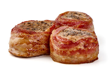 Bacon-wrapped pork medallions, isolated on white background.