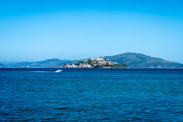 Fototapeta premium Alcatraz Island surrounded by blue waters in San Francisco Bay, USA