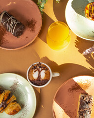 Cozy Breakfast with Muffins, Toast, Orange Juice, and Cappuccino – Morning Food Scene with Warm Natural Light and Homemade Pastries on a Rustic Table