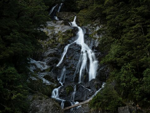 Closeup long exposure shot of Fantail Falls waterfall creek stream Haast River near Haast Pass in Mount Aspiring National Park Westland New Zealand