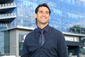 Portrait happy businessman. 35 year old man.