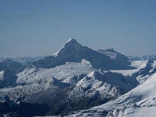 Aerial panorama view of alpine mountain layers landscape, white snow capped peaks of the Southern Alps, Otago Southland South Island New Zealand
