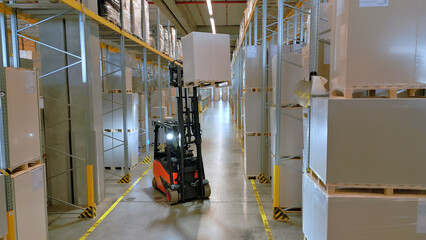 A forklift navigates the aisles of a vast warehouse, highlighting the efficiency of global supply...