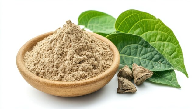 Kava powder in a wooden bowl with leaves and kava root on a white background.