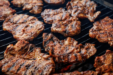 Grilled meat on a barbecue, perfect for summer gatherings with friends and family
