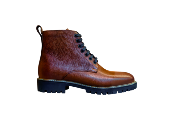Brown leather boots isolated on transparent background. Men's shoes cut out, side view
