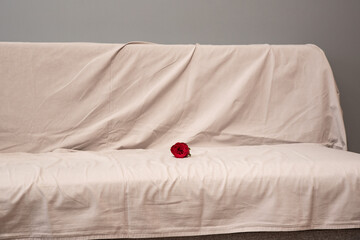 Rose on the bed as a symbol of menstruation