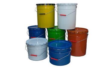 Colorful stack of industrial paint buckets in various shapes and sizes