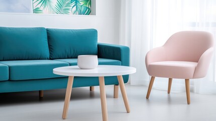 Teal sofa, blush armchair, and white coffee table in a bright, modern living room