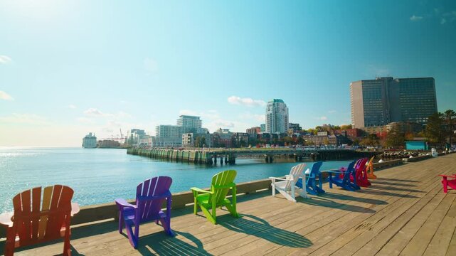 Panoramic view of the harbor district in Halifax, Nova Scotia, Canada. View of the colorful benches overlooking the ocean.
