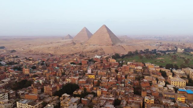Panorama Of Giza City With The Pyramids of Giza In The Background In Egypt. Aerial Drone Shot