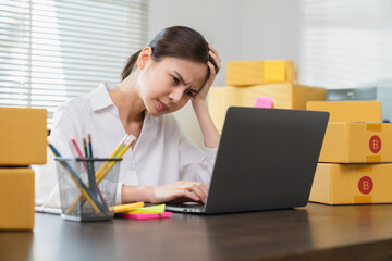 Stressed woman have headaches due to working on a computer screen for a long time. May be office syndrome