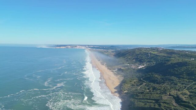 Long stretch of golden beach seen from Miradouro do Salgado, Nazar&eacute;, Portugal