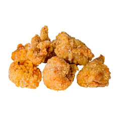 Bite-sized crispy popcorn chicken pieces arranged on white background, showcasing golden-brown crunchy coating and isolated presentation