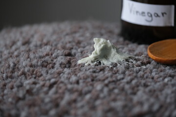 An alternative method removing chewing gum from textured surface using vinegar solution. Concept of daily stains on carpet fiber. top view