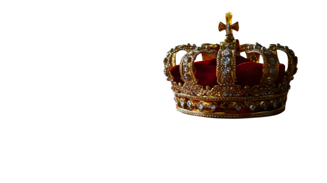 Royal crown resting on red velvet pillow with golden trim