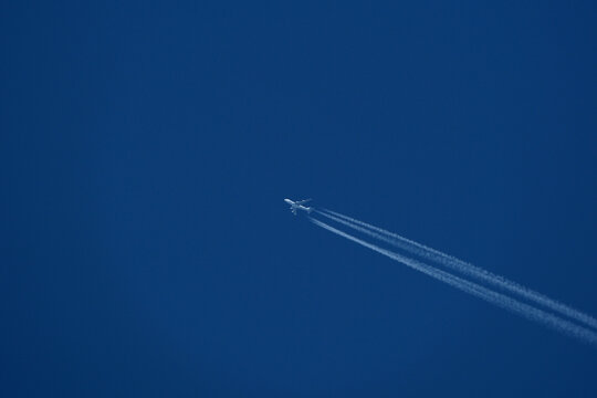 Airplane in the blue sky with contrail. Airplane in the blue sky.