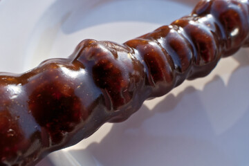 Georgian sweetness churchkhela close-up. Nuts in grape juice. Churchkhela - traditional Georgian candy