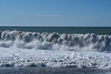Sea waves breaking on the pebble beach on the Black Sea, Batumi, Georgia
