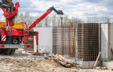 Construction Site With Crane and Concrete Structures in Progress