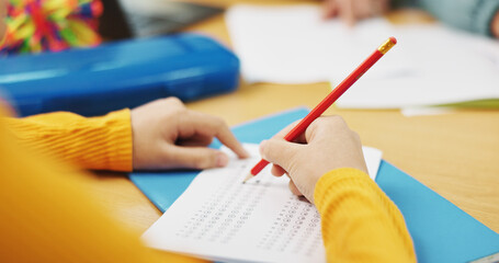 Education, student and hands with test answer for multiple choice assessment, academic evaluation or exam. Classroom, person and writing school questionnaire for scholarship, knowledge or quiz option