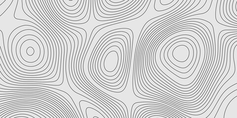 Fototapeta premium A seamless black and white topographic map pattern featuring stylized contour lines that represent elevation. This vintage-inspired design captures the classic look of outdoor maps with intricate line