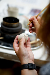 The process of painting Easter eggs, using bees wax as traditional Lithuanian method