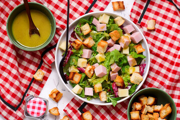 Parisian salad with cheese, ham and croutons