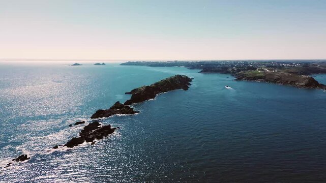 Aerial drone footage capturing the stunning beauty of Pointe du Grouin near Cancale, France, on a sunny day