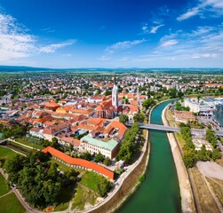 Naklejka premium Stunning Aerial View of a Picturesque European City with River and Cathedral
