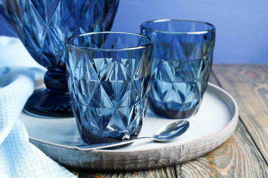 Blue faceted jug, glasses and plate