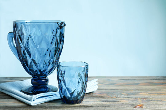 Blue faceted jug and glasses with kitchen towel