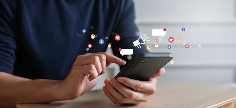 close up businessman hand use smartphone to work about futuristic of social media and business on online marketing with icon for internet network technology and business concept