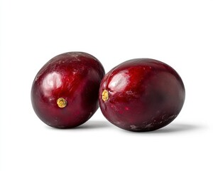 Obraz premium Fresh Purple Plums with Smooth Skin on White Background