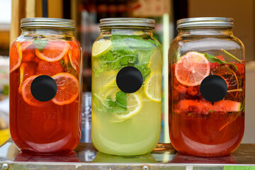 Glass Jars of Homemade Lemonade with Fruit Slices — Refreshing Summer Beverage Scene with Copy Space