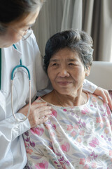 Elderly senior dementia patient (aged old adult person) in nursing hospice home with geriatrician doctor, having happy medical health care from hospital carer or caregiver healthcare service