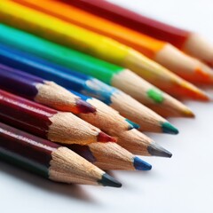 A closeup shot of a row of brightly colored pencils arranged diagonally on a clean, white background 
