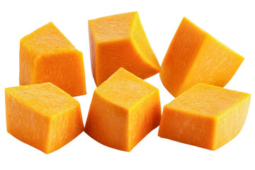 pumpkin cubes - vibrant orange vegetable pieces isolated on black