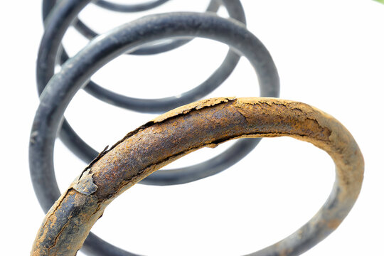 detail of old car spring on white